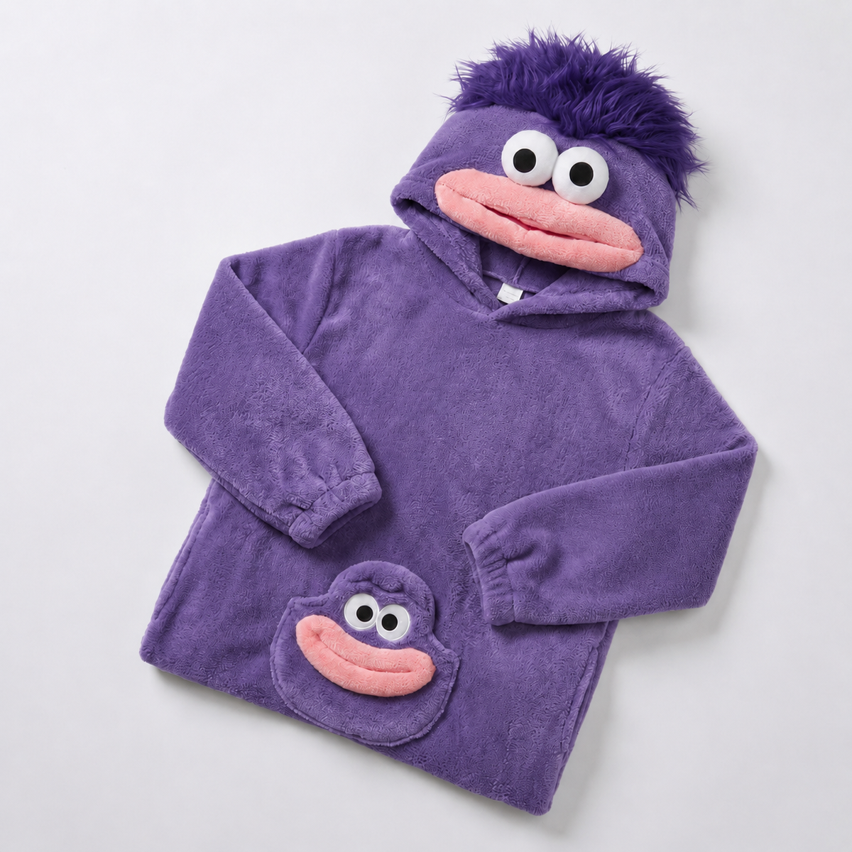 Purple plush monster onesie folded with mouth hood and matching face detail