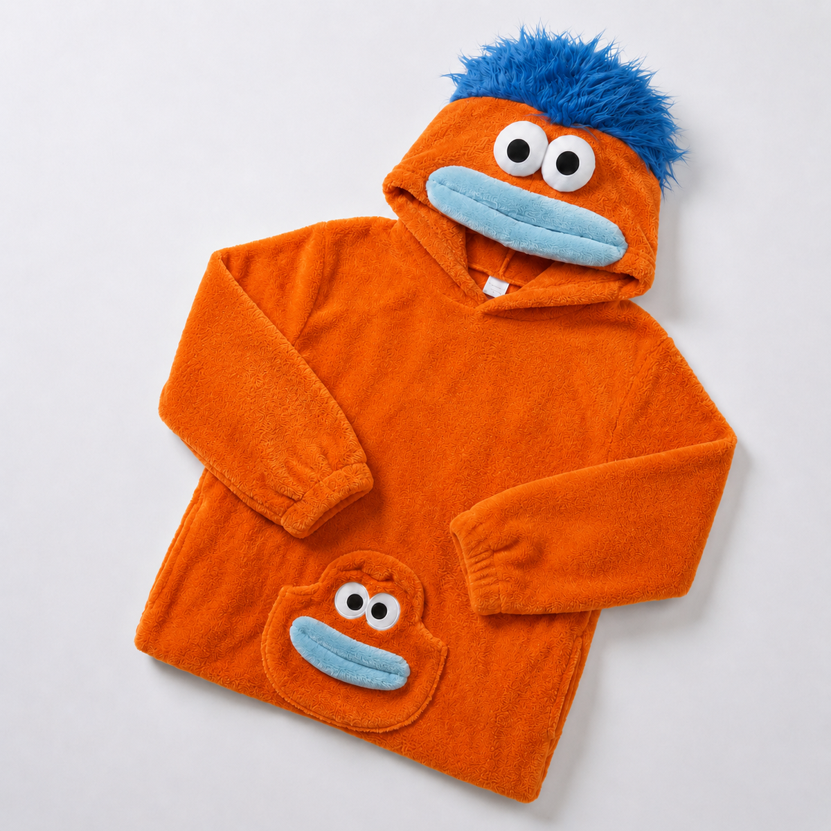 Orange-toned plush monster onesie with blue mouth and hair, source Red option
